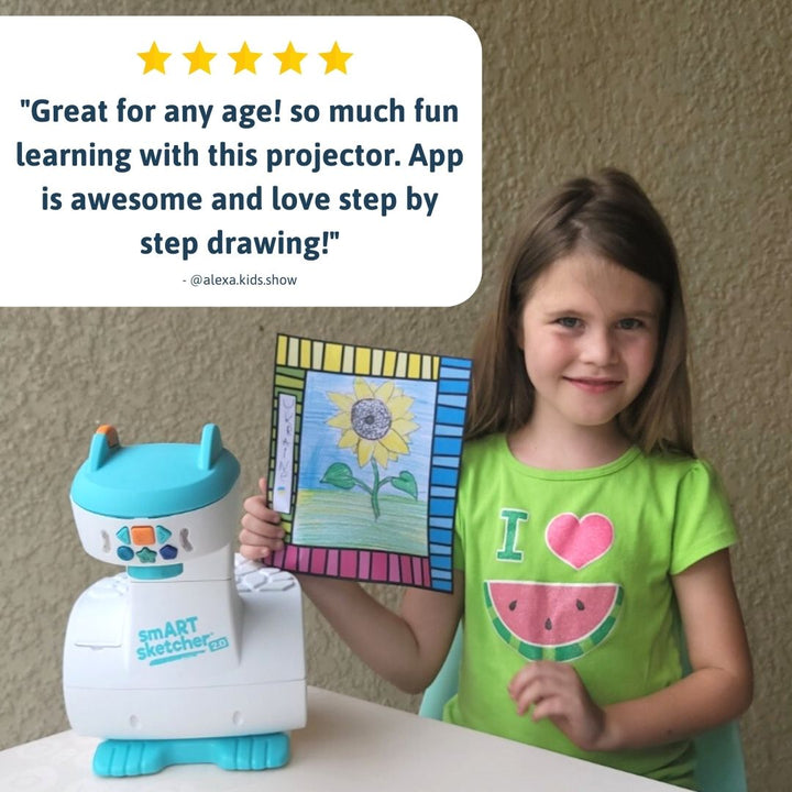 Young girl proudly displays a colorful sunflower drawing created using the smART sketcher 2.0 projector. A five-star review from @alexa.kids.show praises the projector as fun for all ages, highlighting its step-by-step drawing guidance and app integration. Educational STEM toy for creative kids learning to draw with confidence.